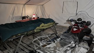 Build Small Tent in Big Tent: Snowmobile in tent.