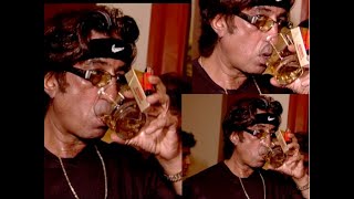 Shakti Kapoor drinking and smoking at a Bollywood party in Mumbai