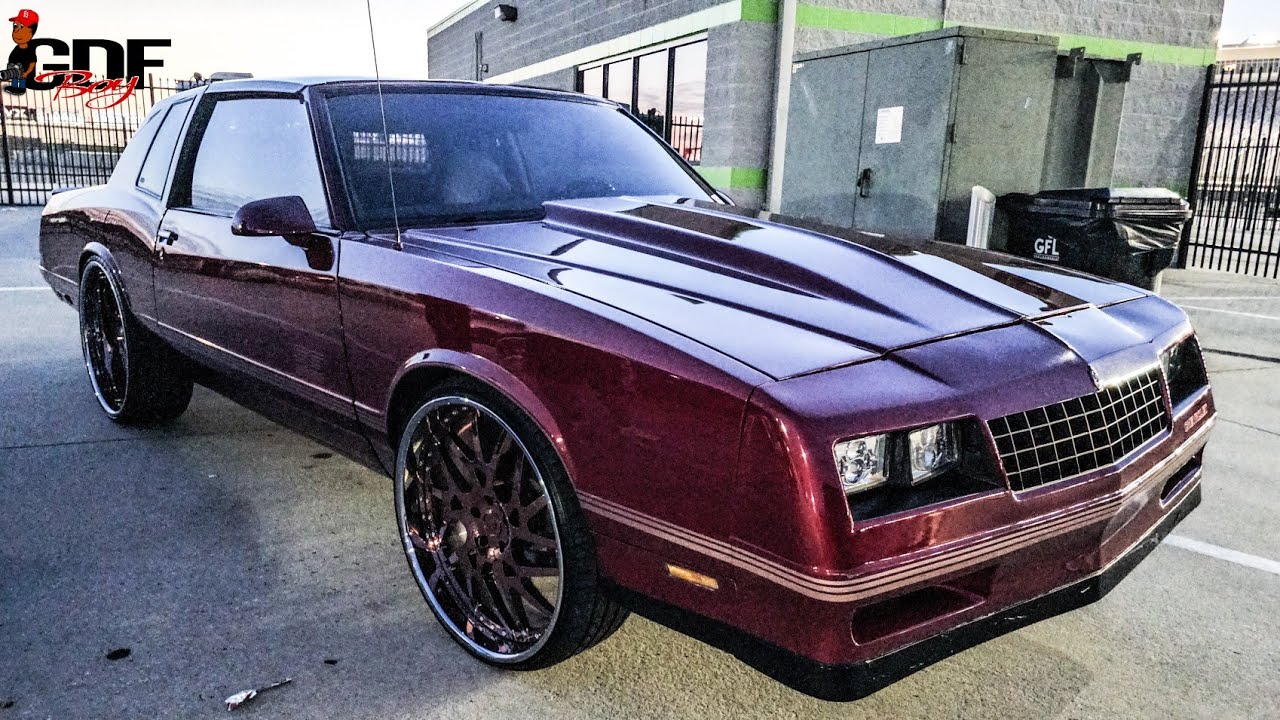 Red T - Top Monte Carlo SS Sitting on Rose Gold Face 24" Forgiato Twisted Maglia Wheels.