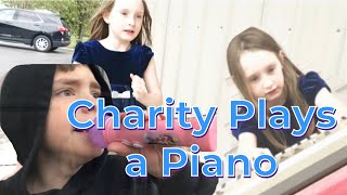 Charity Plays a Piano