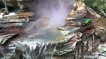 Hòn non bộ kết hợp tranh đắp nổi làm nền