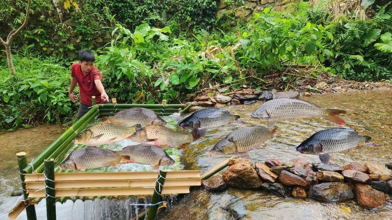 The boy, Lam, used an ancient fishing method, and luckily he caught many fish in the trap.