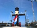 Steam Tug Hercules whistling under the Botlek bridge Rotterdam Holland