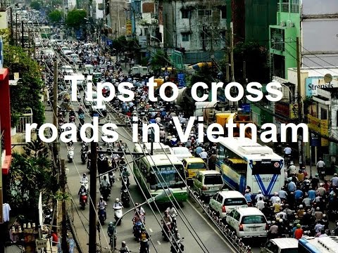 VIETNAM how to cross roads in Hanoi (sd-video). 