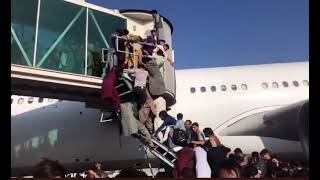 Hundreds Scramble To Get On The Plane As Taliban Takeover Kabul