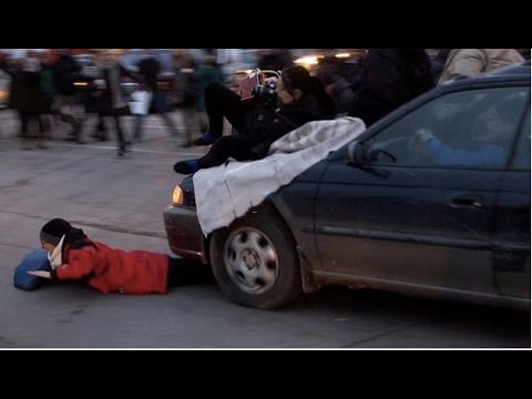 Frustrated Driver Plows Through Protestors Blocking an Intersection