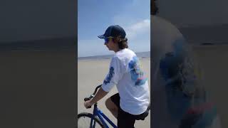 Jake riding bike on Jekyll Island beach.