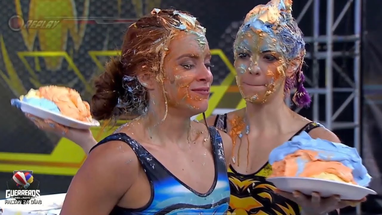 Puerto Rican and Colombian women smash double pies in each other's faces