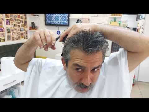 MUNUR ONKAN, THE WINNER OF TURKEY IN HAIR CUTTING, SHAVES HIMSELF