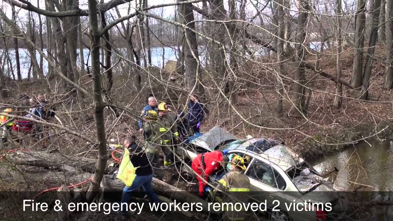 2 seriously injured after car flips over guardrail, lands in creek ...