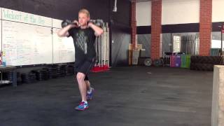 Double-Arm Kettlebell Rack Walking Lunge