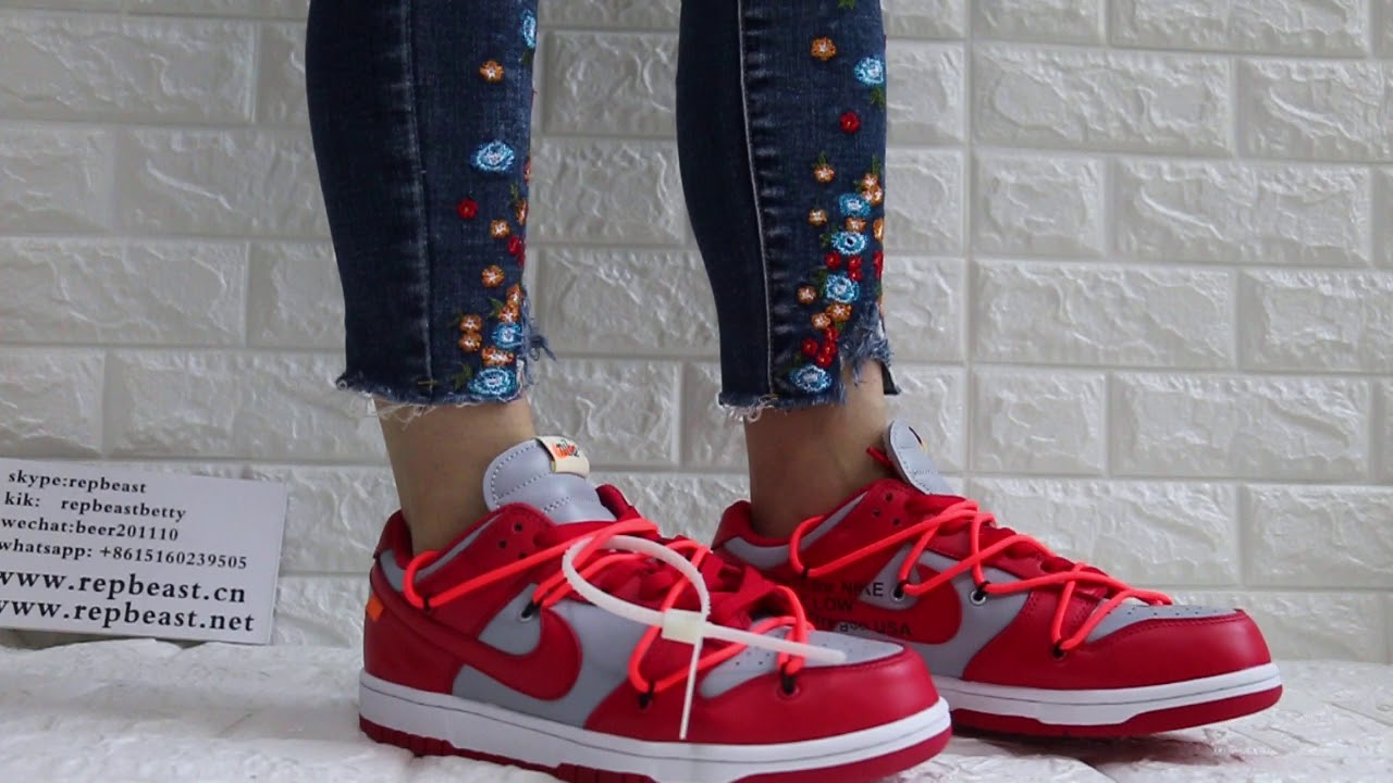 dunk low university red on feet