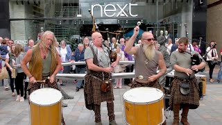 Thundering drums of Scottish street band Clanadonia playing Spanish Eyes in Perth City centre