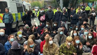 UK protesters try stop migrant removals from temporary accommodation | AFP
