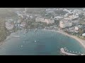 D-Log M. Avsallar, Alanya, Turkey. Aerial view of a vibrant tourist bay with sandy beaches and ho...