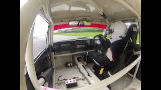 Lotus Cortina chasing a Porsche GT3 at Goodwood