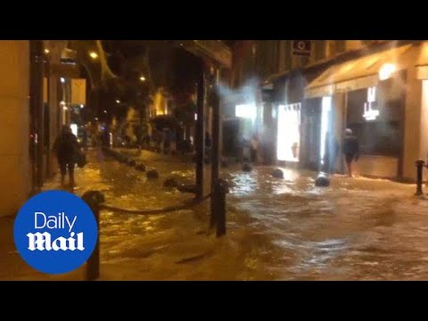 Brown dirty water washes through streets in Cannes - Daily Mail