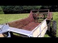 Massey Ferguson with land drive spreader