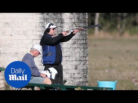 Russell Crowe practises shooting with friends in the country