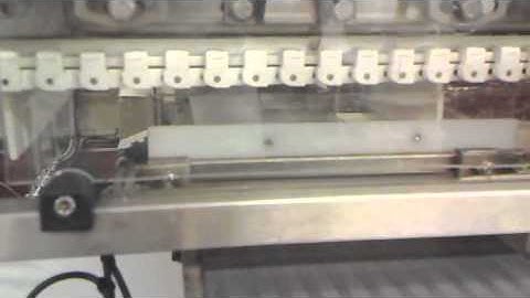 Auto loading of trays into crates