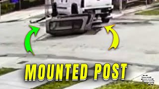 Driver Hits and Mounts Yellow Post