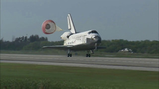 Space Shuttle Discovery lands and deploys parachute