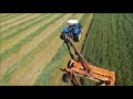 New Holland 6050 & New Holland Discbine H7450 cutter in Action