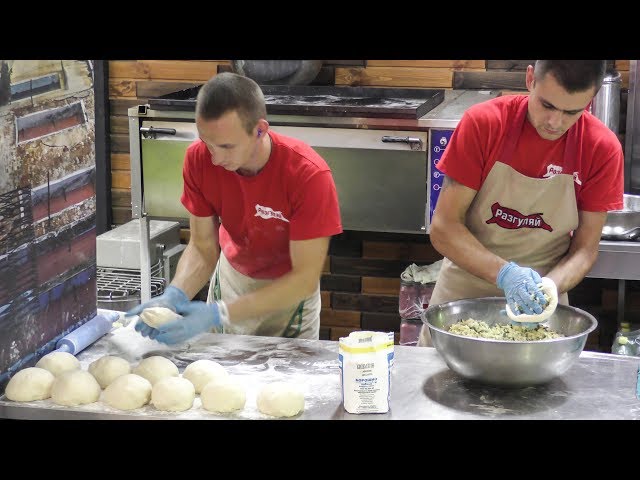 Preparing Skewers and Flat Cakes with Cheese. Street Food in Kiev, Ukraine