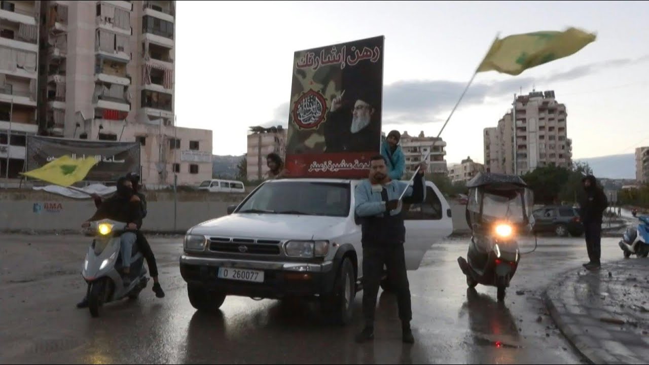 People celebrate ceasefire with Hezbollah flags in Beirut's southern suburbs | AFP