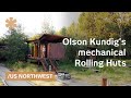 Rolling huts: metal-clad tiny wheeled homes move on a meadow