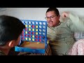 playing connect 4. (father vs son)