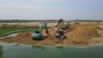 Greatest Action SHANTUI Bulldozer Operator soil pushed and Truck unloading soil filling huge lake