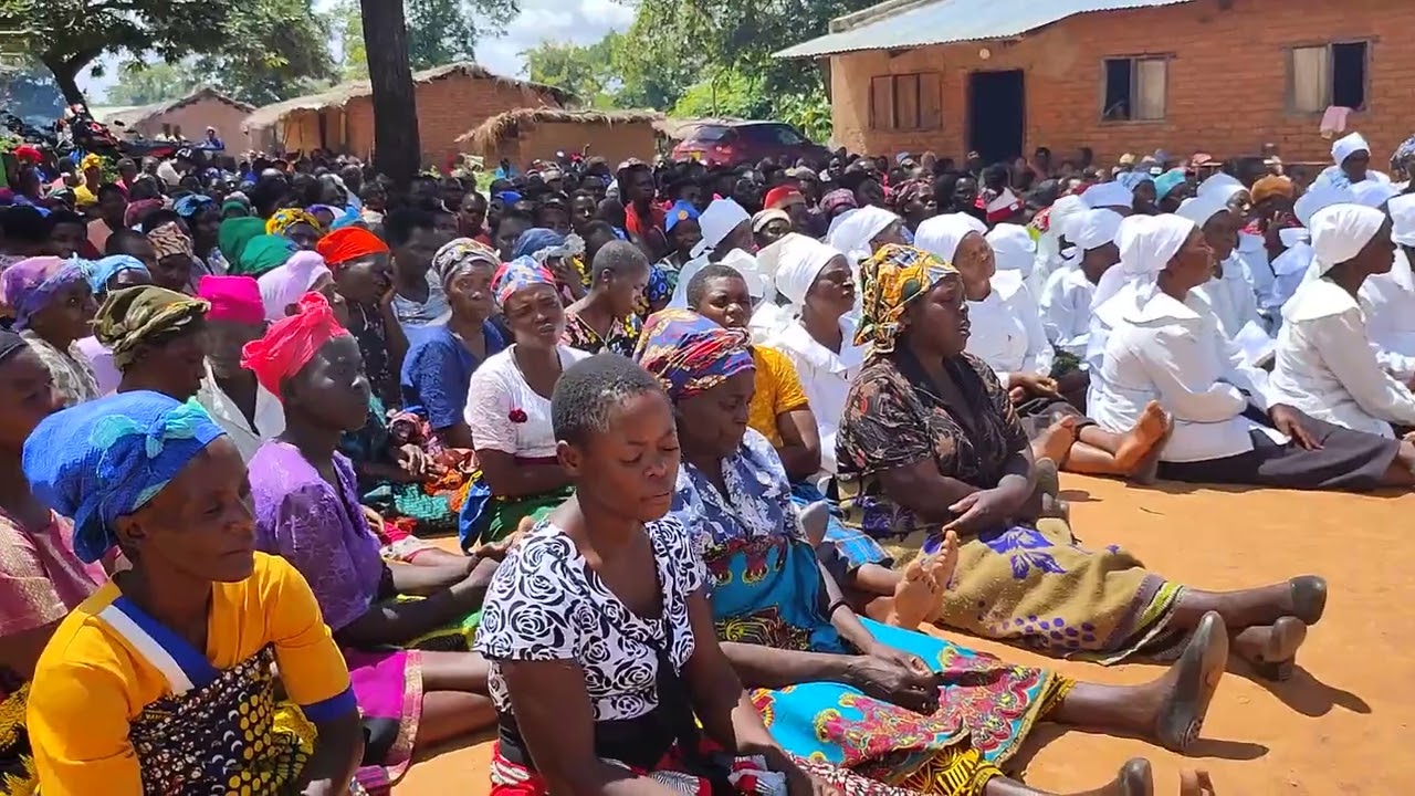 Rev. Alexander Kambiri preaching in Malomo, Ntchisi