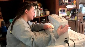 Family, neighbors join forces to make masks amid coronavirus (COVID-19) crisis