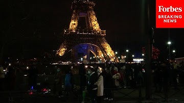 Revelers Visit Eiffel Tower In Paris To Ring In New Year