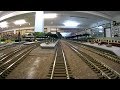 Train cab ride along a never ending model railroad layout in HO scale