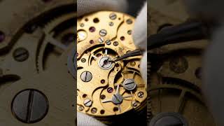 Deep-cleaning 1940s pocket watch gears in macro