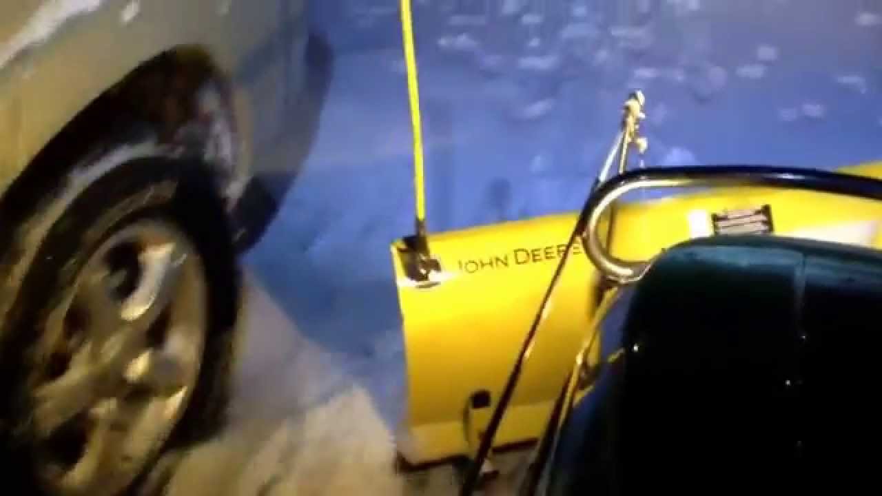 John Deere X500 plowing snow. YouTube