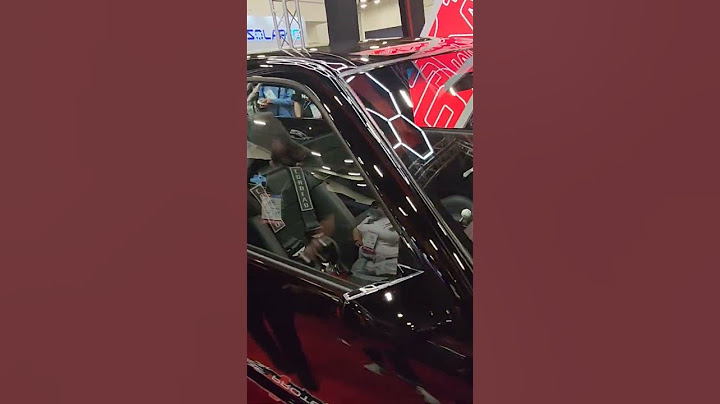 Gas monkey garage and Richard Rawlings showing their black GMC OBS pickup truck build at #sema2024