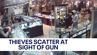 Thieves scatter after store employee pulls out gun to thwart robbery