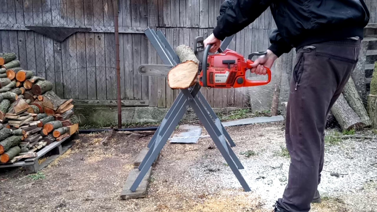 Cutting fuel wood in a wood cutting stand - YouTube
