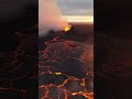 Glowing lava and a large plume of smoke  #volcano#lava #fire#smoke#sunset#natural #landscape#drone