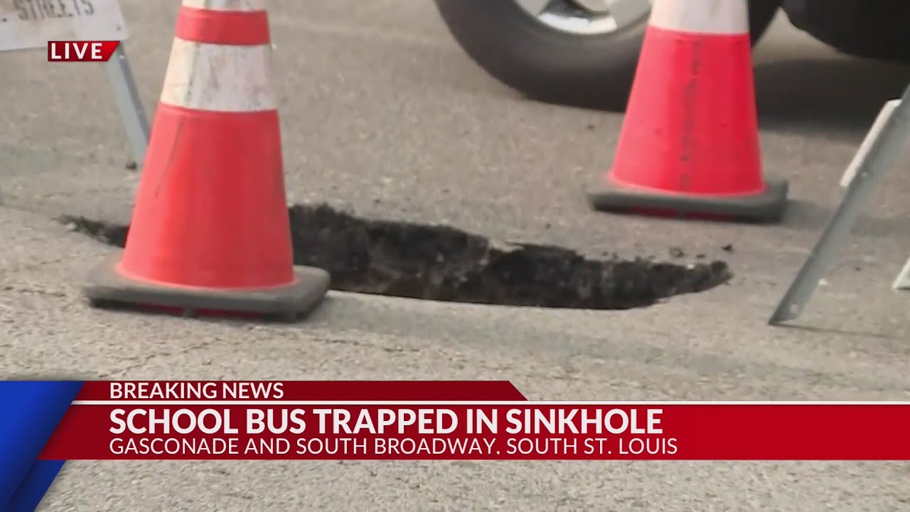 St. Louis school bus trapped in sinkhole - YouTube