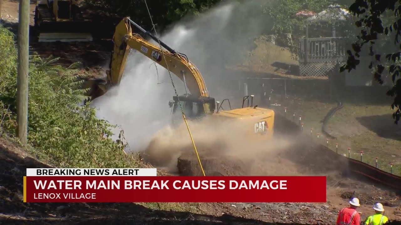 Water main break damages nearby homes - YouTube