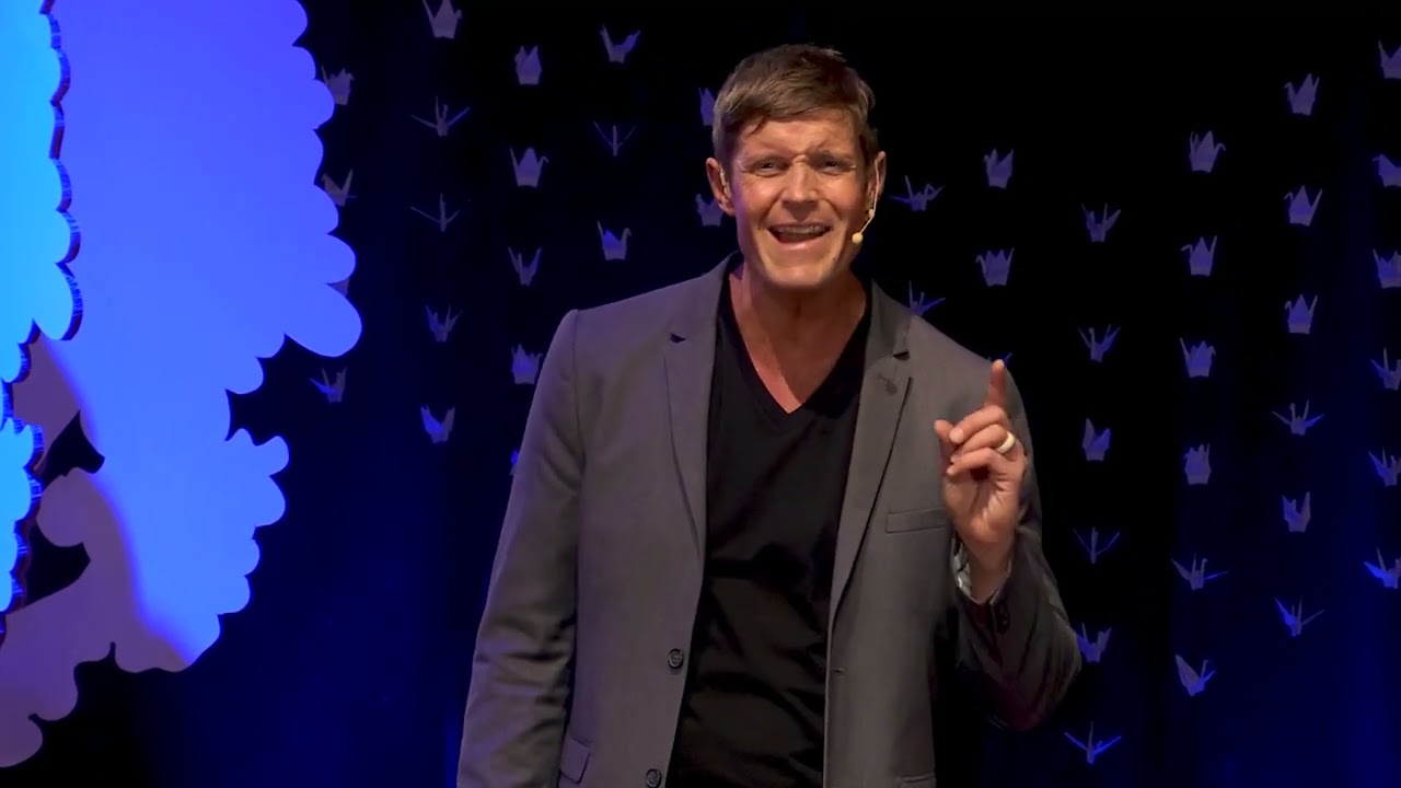 Dai Manuel on stage at TEDxBearCreekPark delivering "Why Vulnerability is a Human Thing"