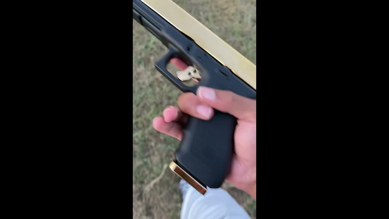 ONE HAND GOLD GLOCK 50 Gi SHOT 