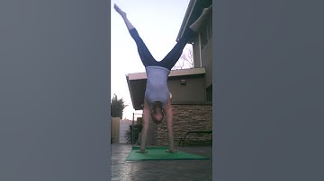 Handstand press down to split hold