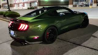 2022 Ford GT500 Shelby Cobra in Eruption Green at night.