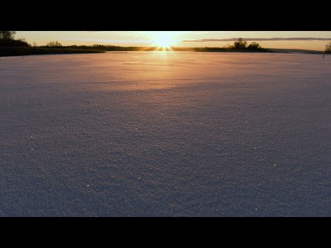 Drone aerial footage, low altitude, winter sunset