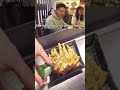 How do customers react in this okonomiyaki restaurant?